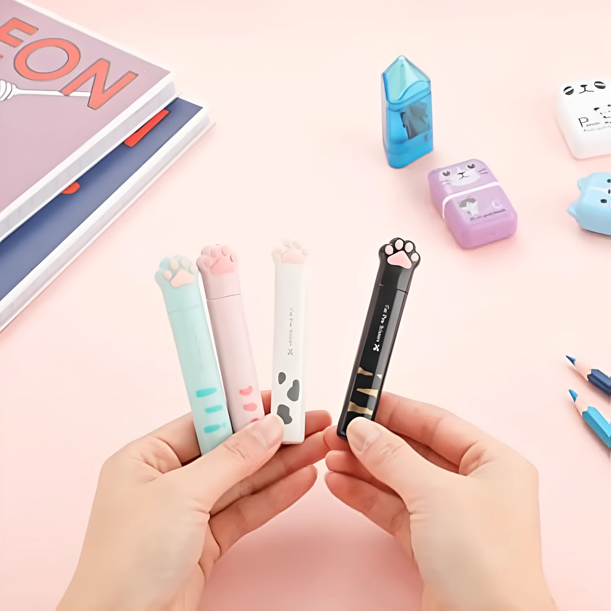 Cat paw mini folding scissors in four colours showing closed safety position and decorative handles
