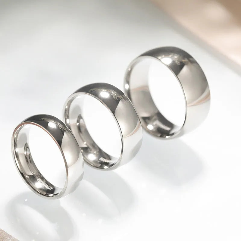 Silver titanium steel ring showing 2mm, 4mm and 6mm width options on size chart