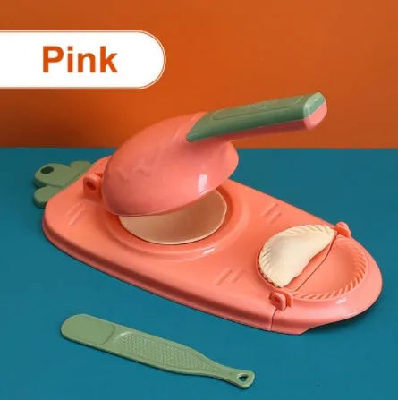Orange and white plastic dumpling maker tool with ergonomic handle and hanging hole