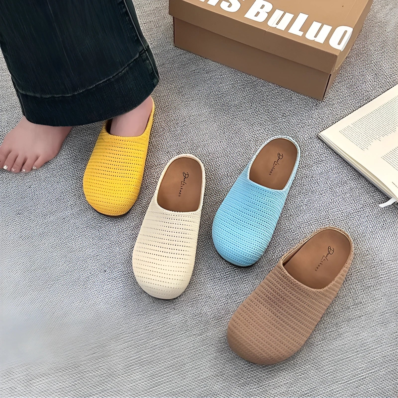 Women's blue cloth slippers with round toe and non-slip rubber sole, shown from the side.