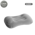 Grey inflatable travel pillow with flocking finish shown inflated to 45x30x13cm dimensions for neck support