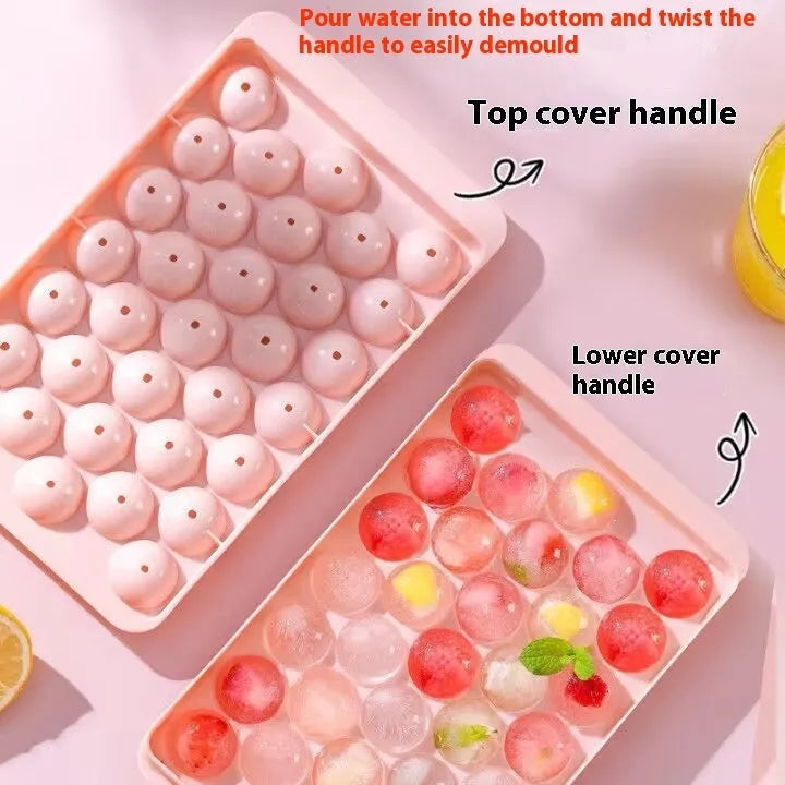 Silicone ice cube tray with lid in blue or pink, showing 33 round ice moulds measuring 24x14 cm.
