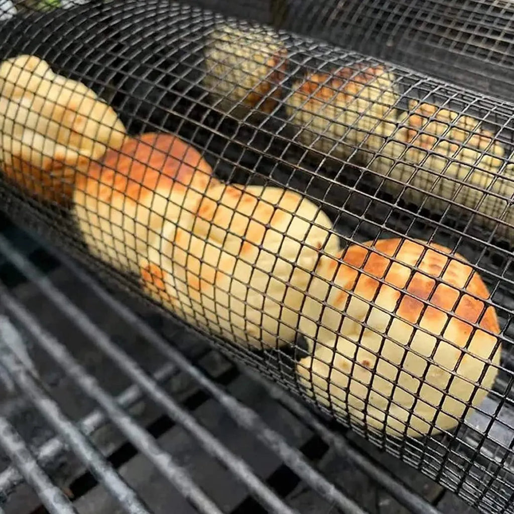 Stainless steel cylindrical rolling barbecue basket with wire mesh for grilling vegetables and meat.
