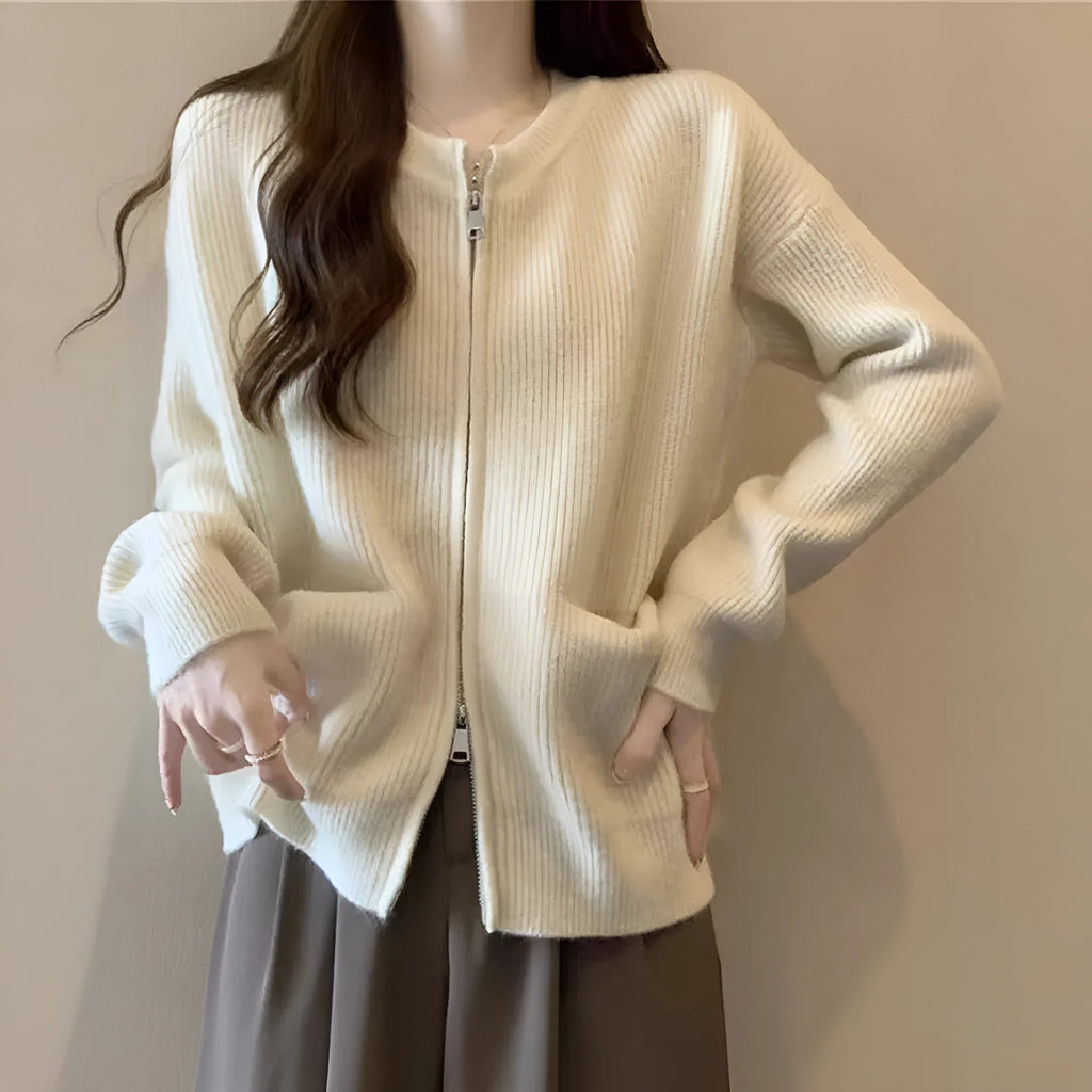 Beige viscose fibre long-sleeve sweater coat cardigan laid flat, showing soft drape and button front.