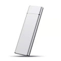 Ultra-thin silver metal external hard drive with data cable on a desk.