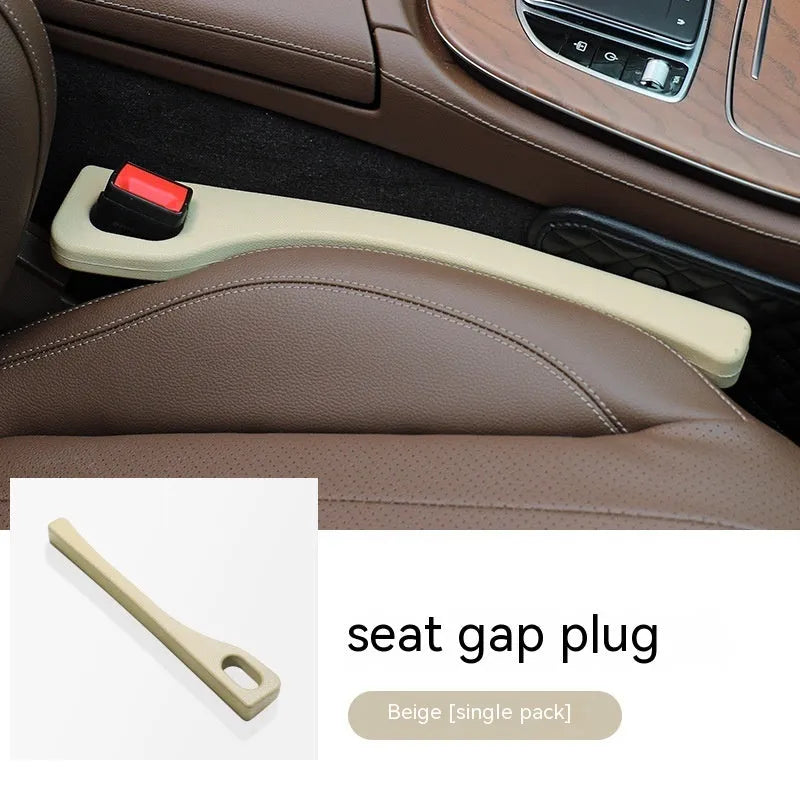 Car seat gap filler strip in polyurethane material shown installed between vehicle seat and centre console
