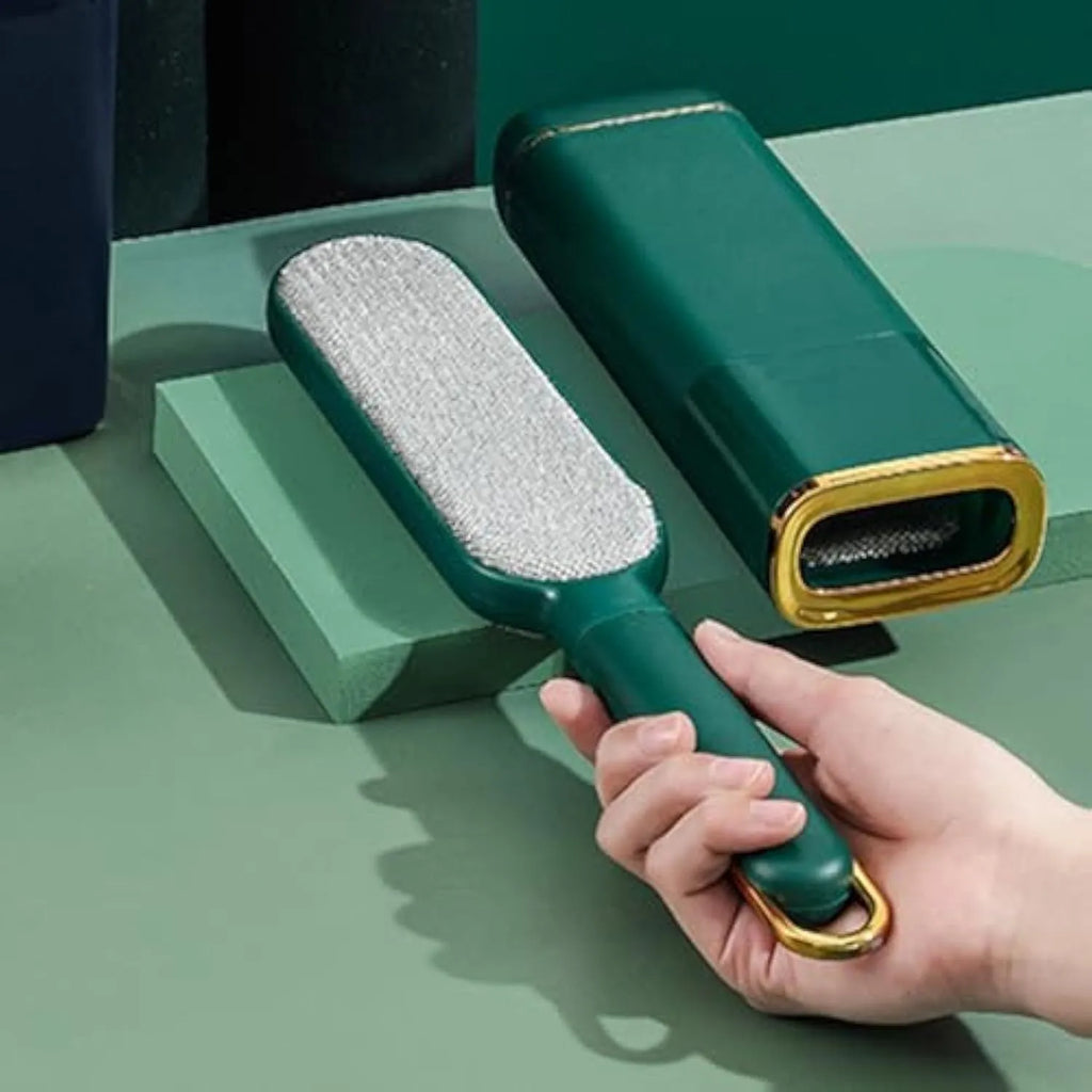 Blue green and white reusable pet hair remover brush with self-cleaning storage base.