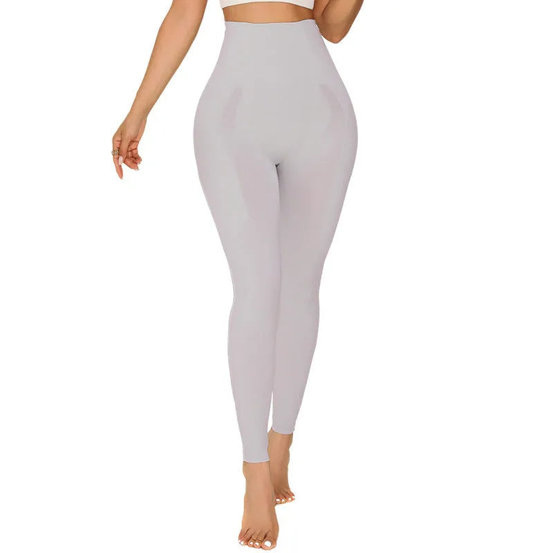 Women's belly contracting sports yoga trousers in black with lumbar support and seamless construction