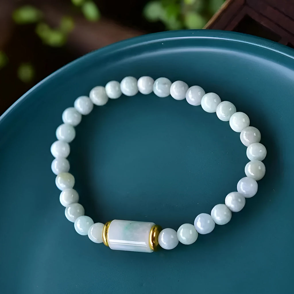 Myanmar Jade round bead bracelet in emerald green with geometric ethnic style design