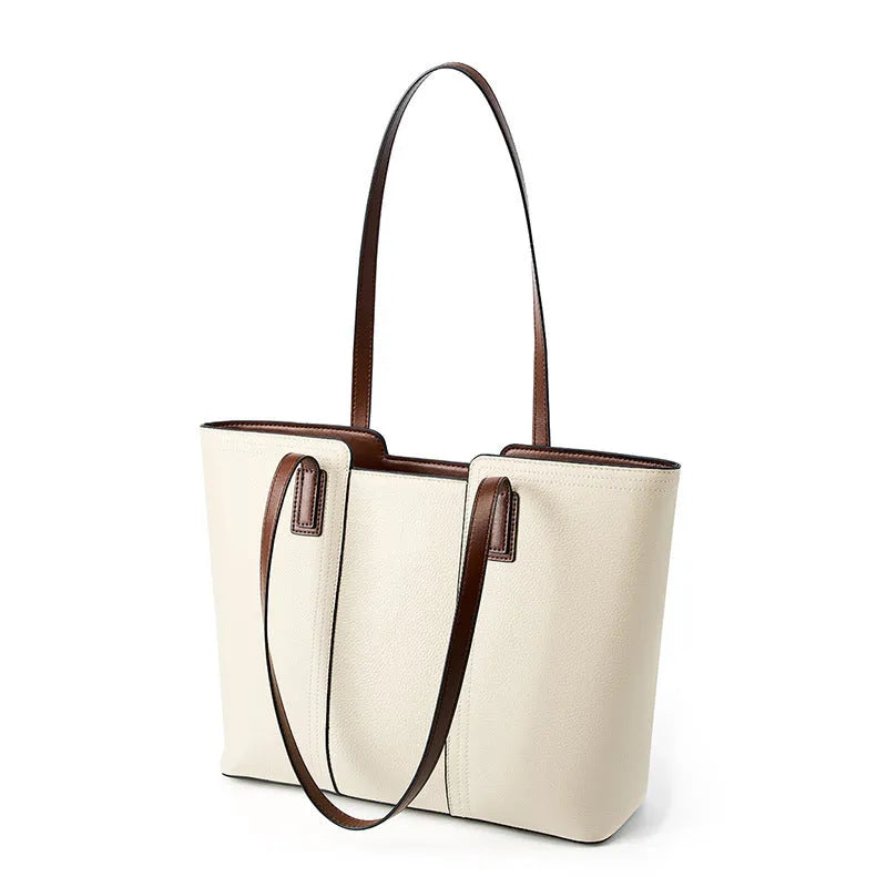 Women's black genuine leather crossbody bag with square shape and single shoulder strap.