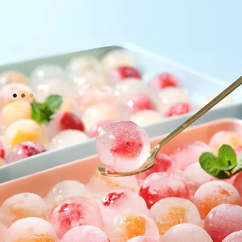 Silicone ice cube tray with lid in blue or pink, showing 33 round ice moulds measuring 24x14 cm.