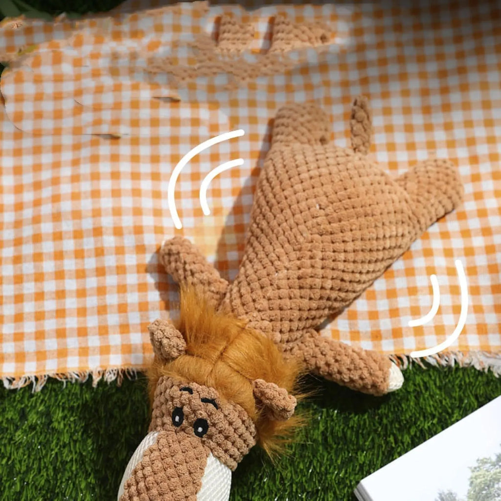 Green corn kernel shaped plush dog toy with a squeaker for interactive chewing and teeth cleaning