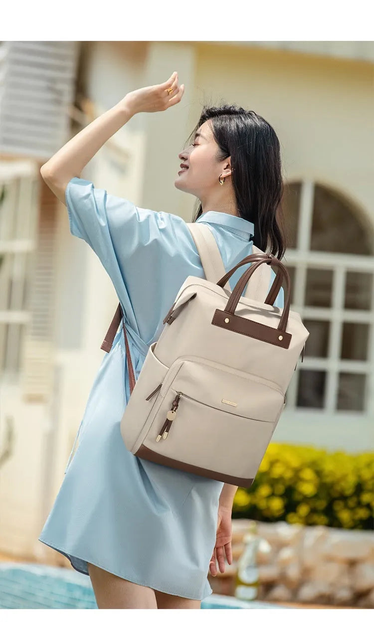 Women's apricot backpack with adjustable shoulder strap showing front view