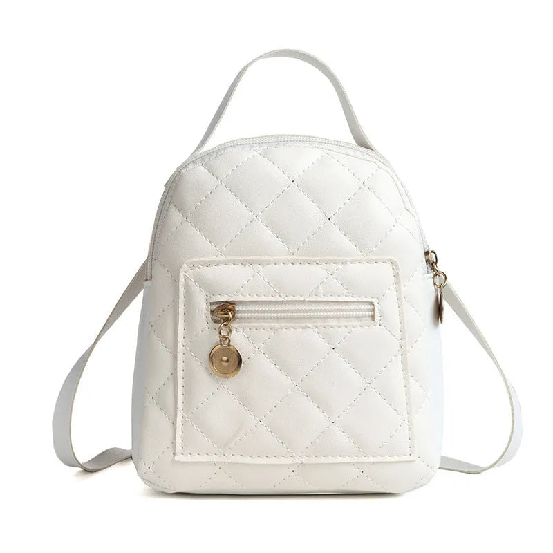 Girls' hard square PU backpack with embroidery in pink, showing front sandwich pocket and carry handle.