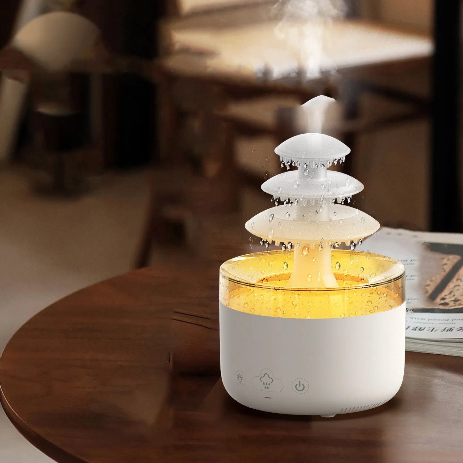 White cloud rain humidifier and essential oil diffuser with LED mood lighting on table