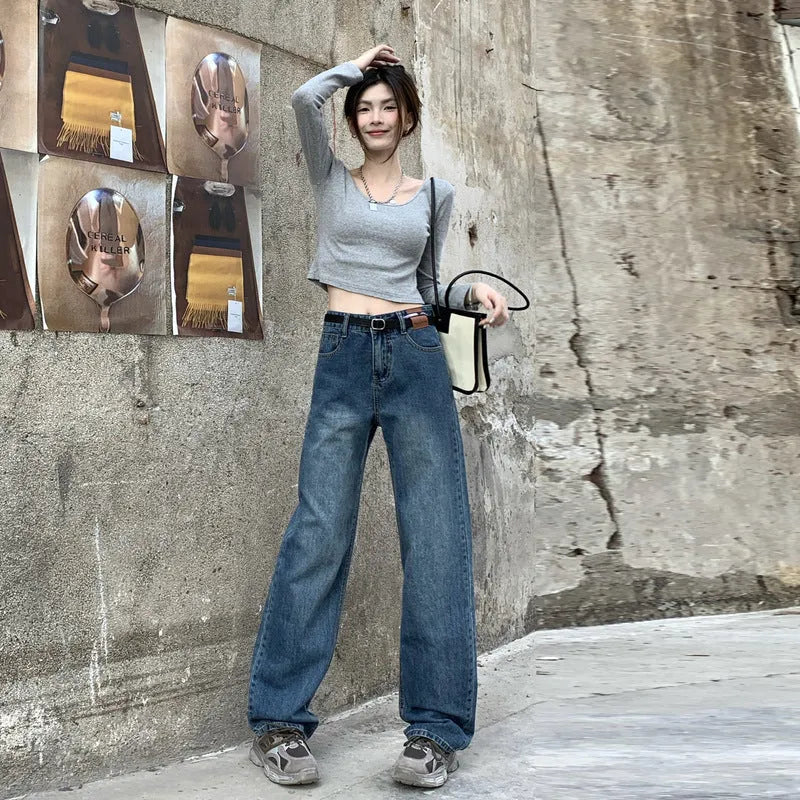 Women's high-waisted retro blue straight-leg jeans on a neutral background