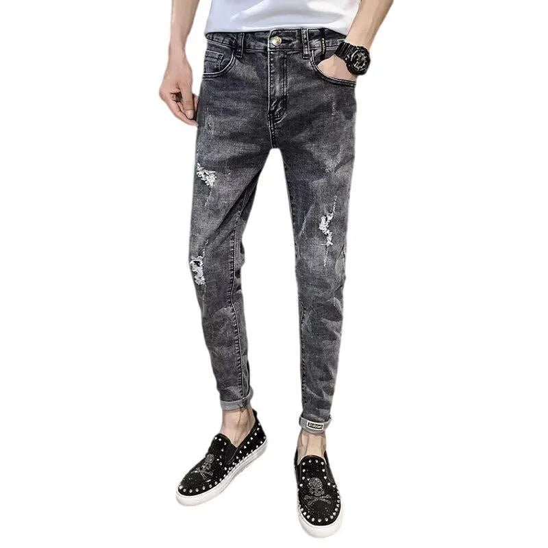 Man's high-waist blue denim jeans with a button fly on a plain background.