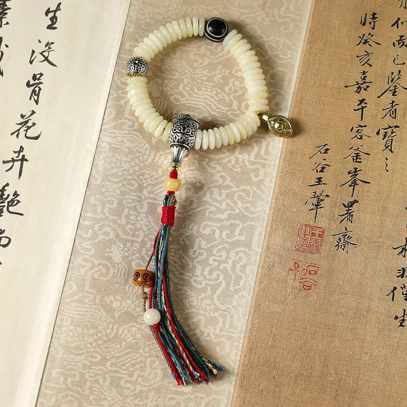 Tibetan white bodhi seed Buddhist bracelet or handheld mala with traditional knotting
