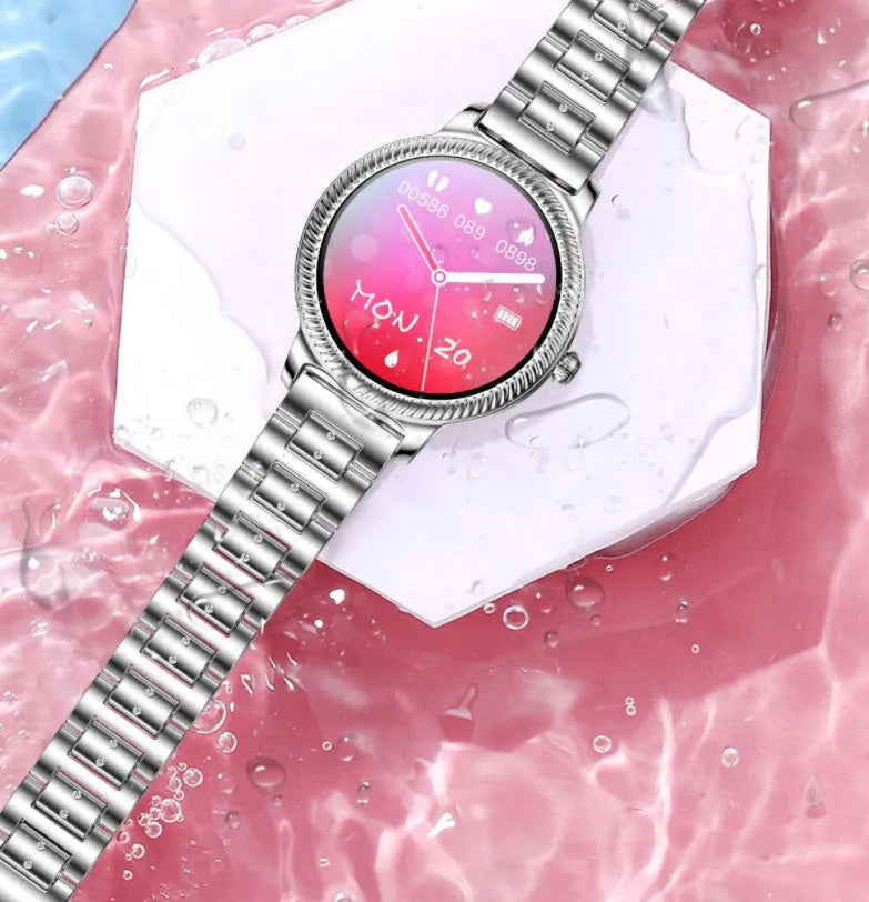 AK38 ladies smart watch with stainless steel Milanese band showing on a wrist.