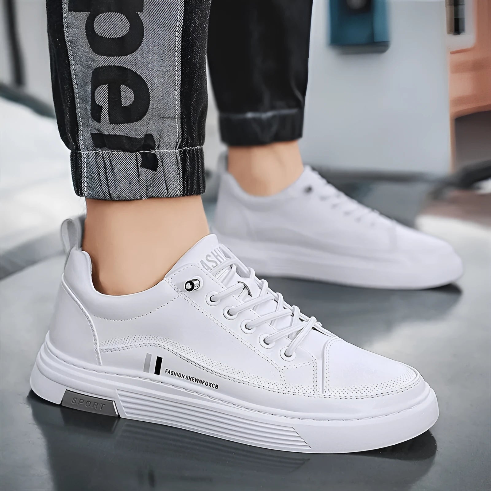 Men's low-top skate shoes in black with a round toe, elastic band, and rubber sole.