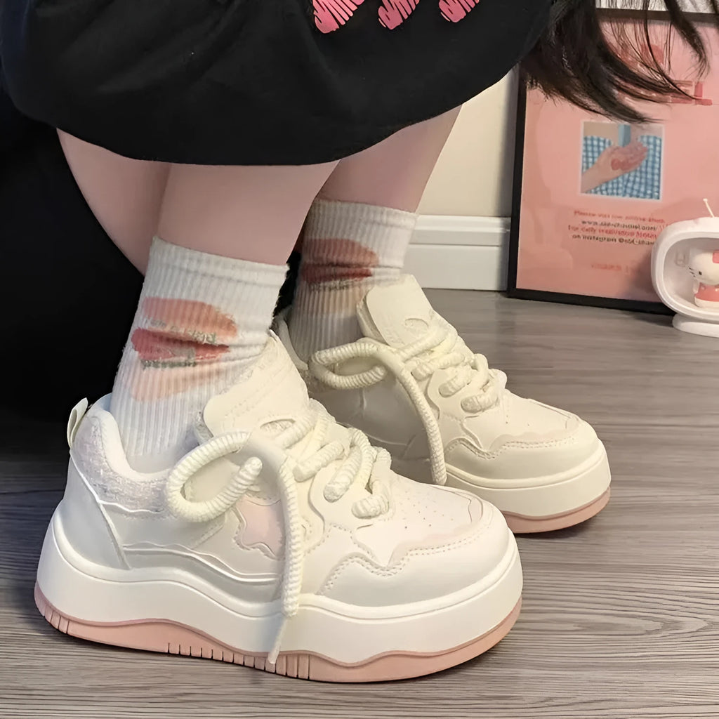 Women's green platform sneakers with lace-up front and round toe design on rubber sole