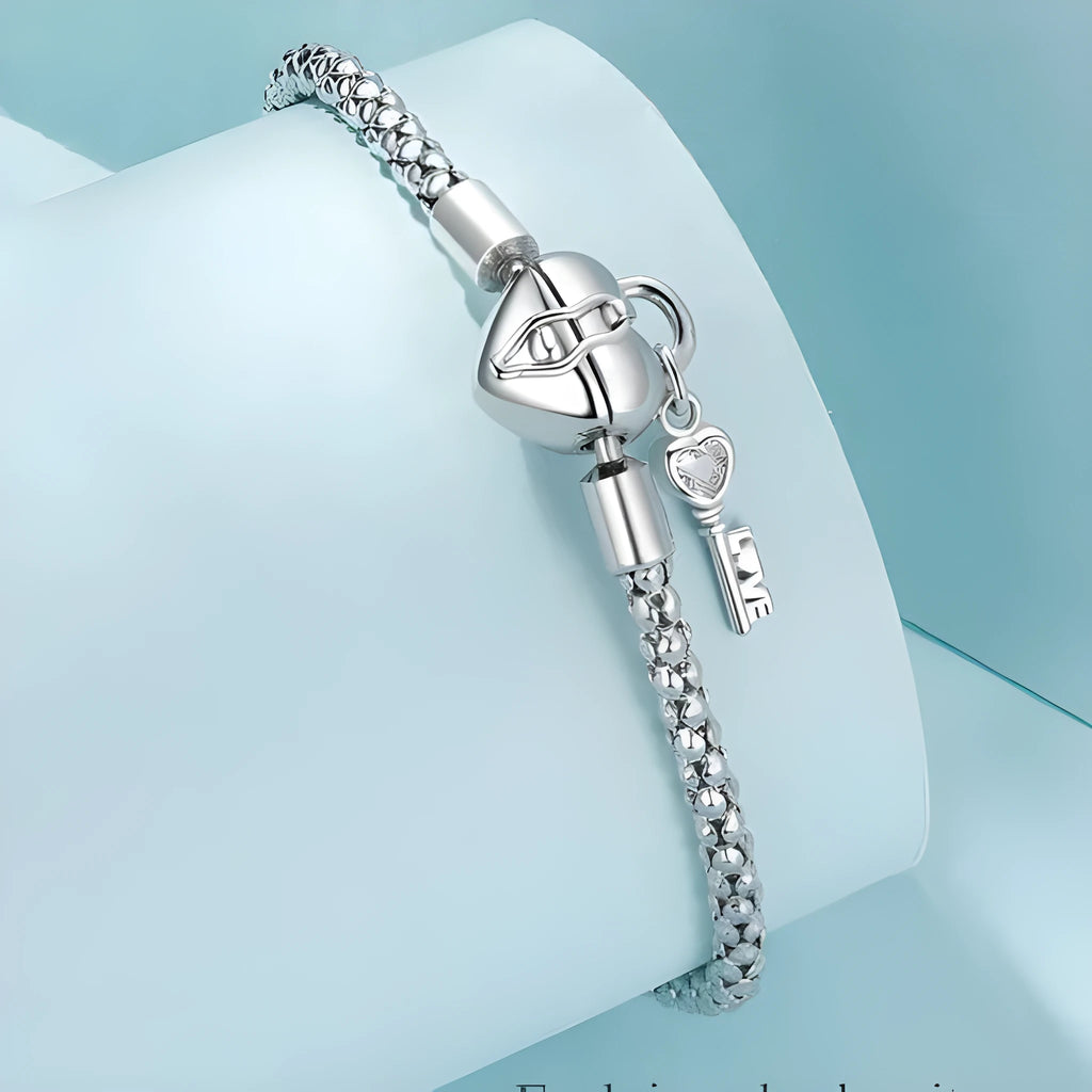 925 silver heart lock key bracelet with electroplated finish on neutral background
