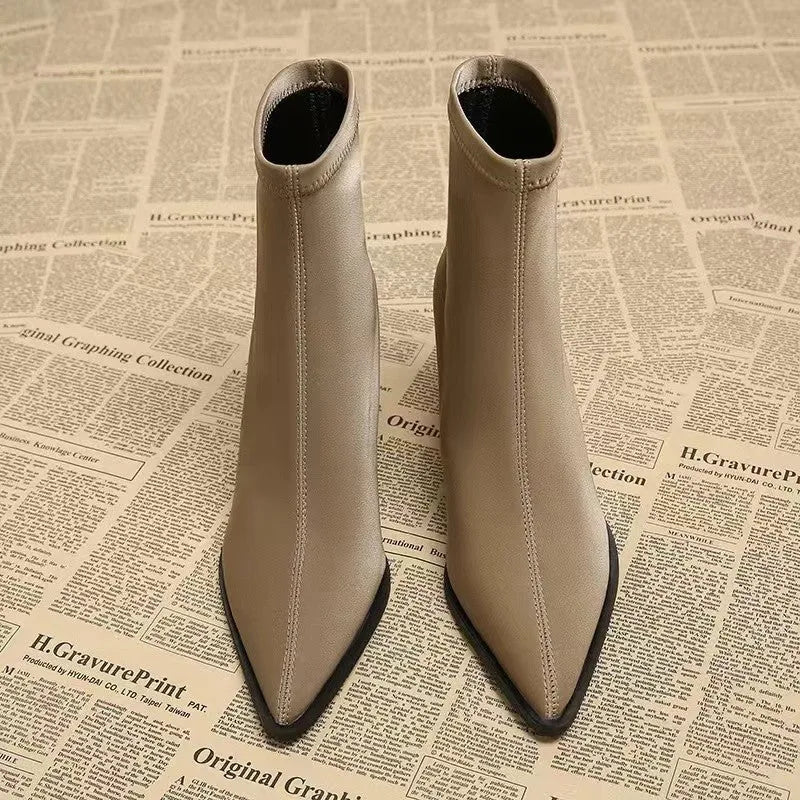 Women's khaki pointed toe Martin boots with a wedge heel and stretch artificial velboa upper.