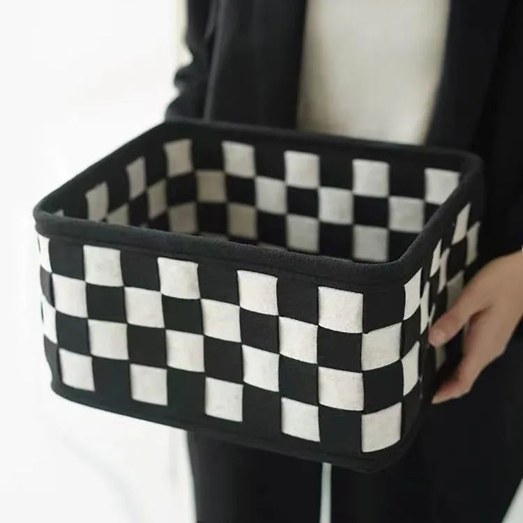 Checkerboard patterned grey felt storage basket with folded sides, shown with dimensions 37cm by 29cm by 19.5cm.