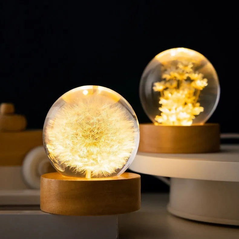 Luminous dandelion preserved in a resin crystal ball on a beech wood stand, USB powered.