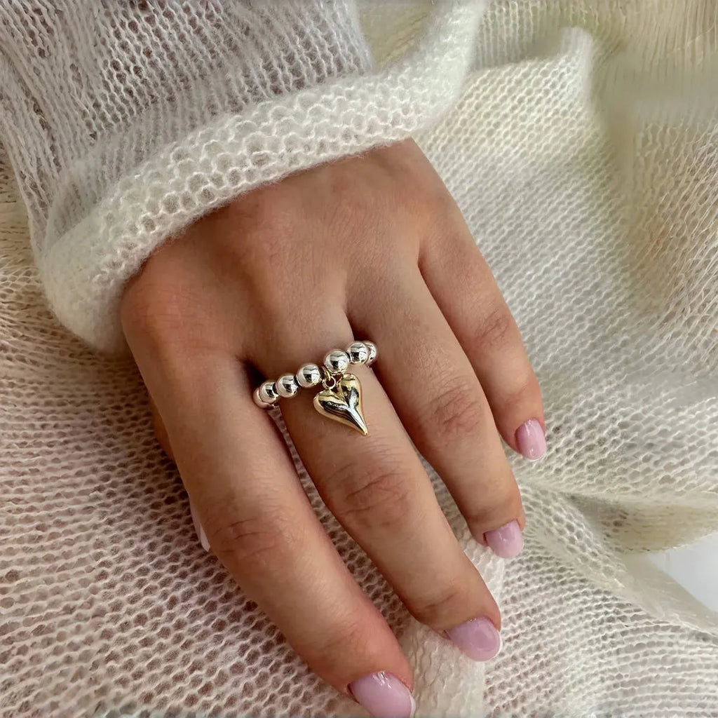 Handmade beaded elastic string love ring with geometric heart design in gold electroplated finish