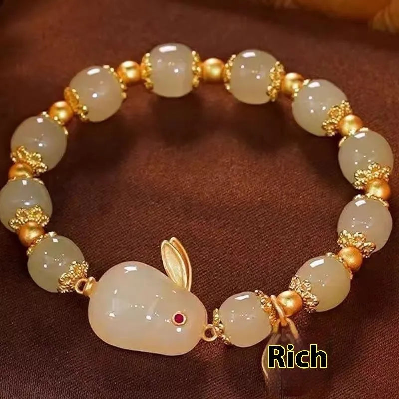 Green mixed-material jade hare bracelet with electroplated finish and lily decorative elements