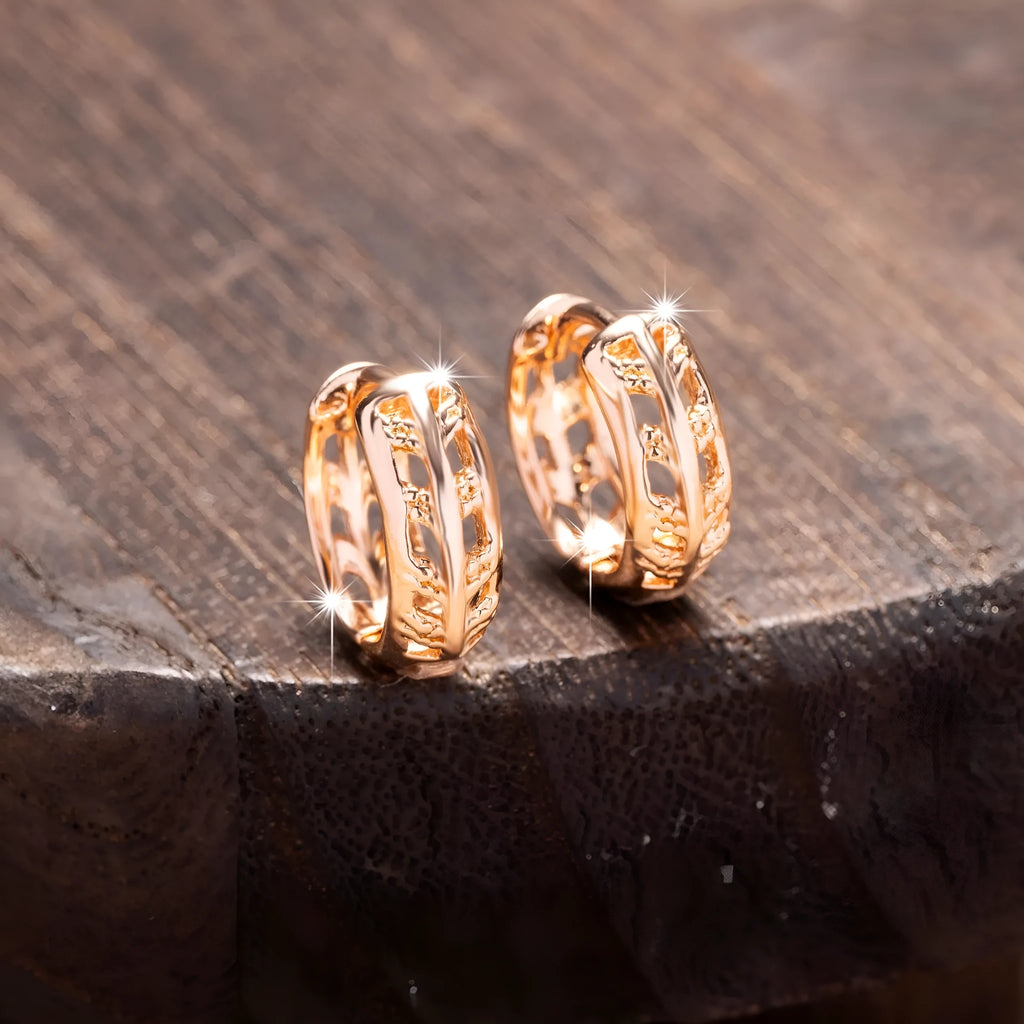 Small copper earrings with hollowed-out leaf and heart shapes, rose gold plated.
