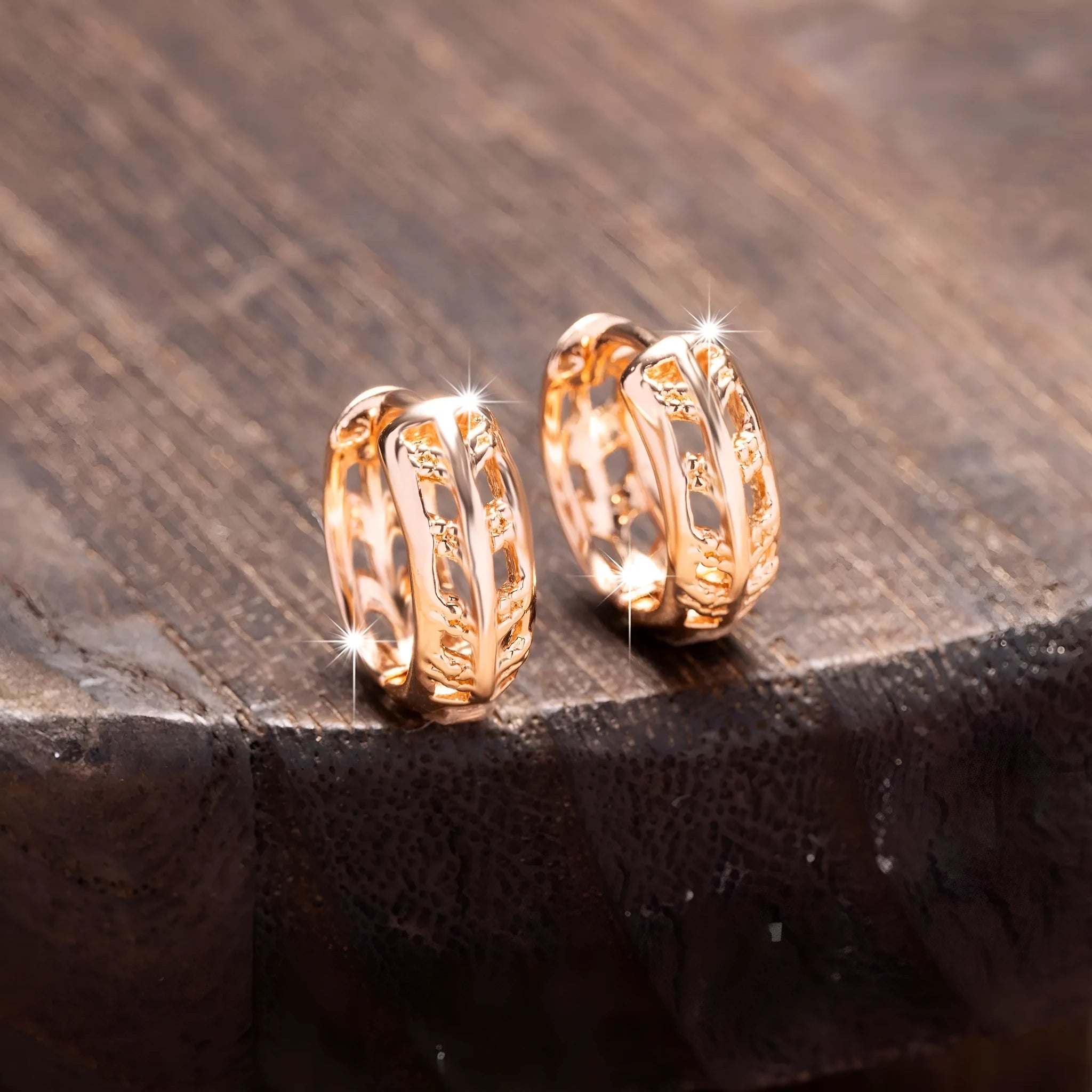 Small copper earrings with hollowed-out leaf and heart shapes, rose gold plated.