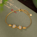 Close-up of a retro fox charm women's bracelet in 925 silver with a natural stone centre on an adjustable chain.