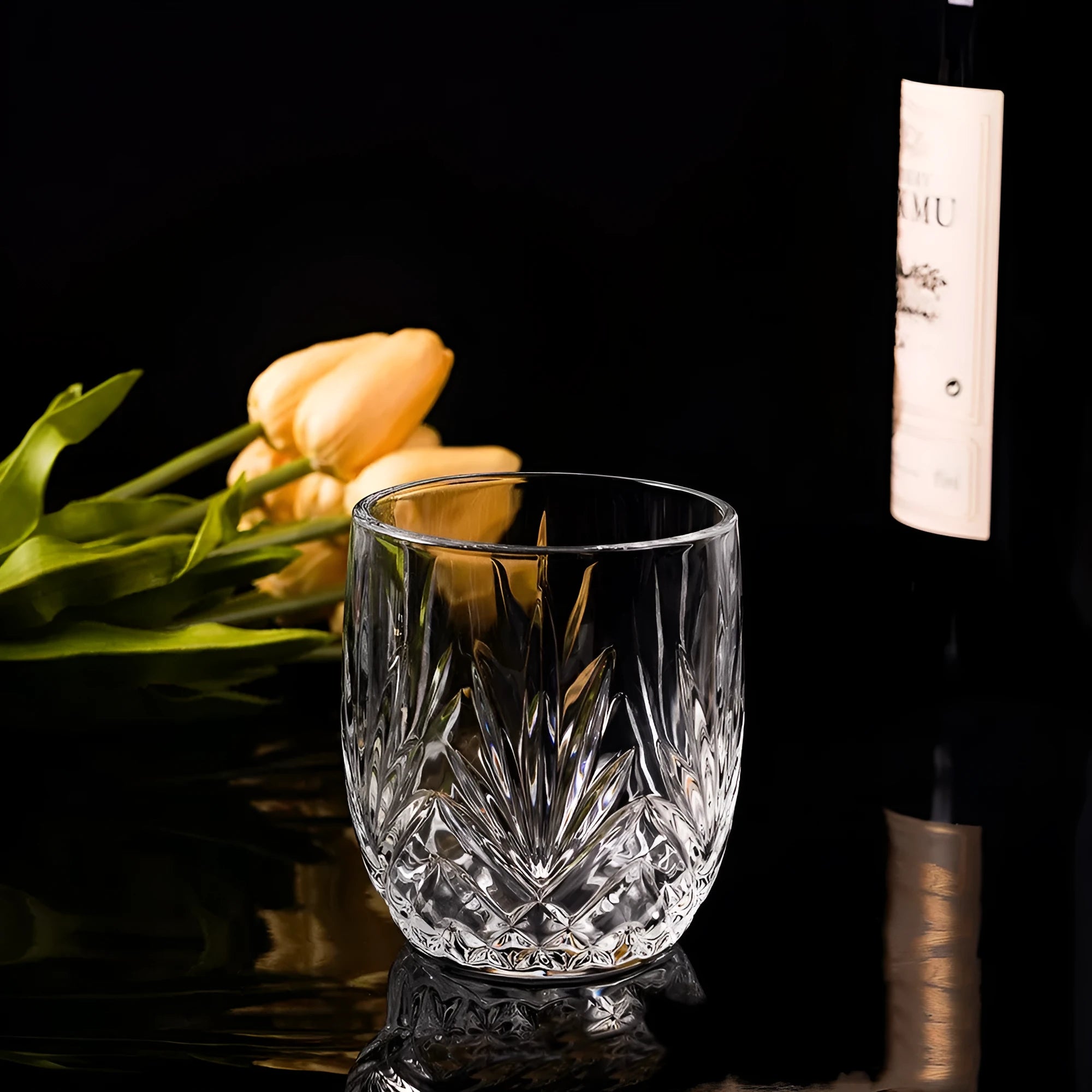 Clear thick-bottom whiskey shot glass on a table, one of 12 available colour variations.