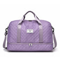 Large 55-litre buggy style travel bag in Oxford cloth, shown in a solid colour with shoulder straps.