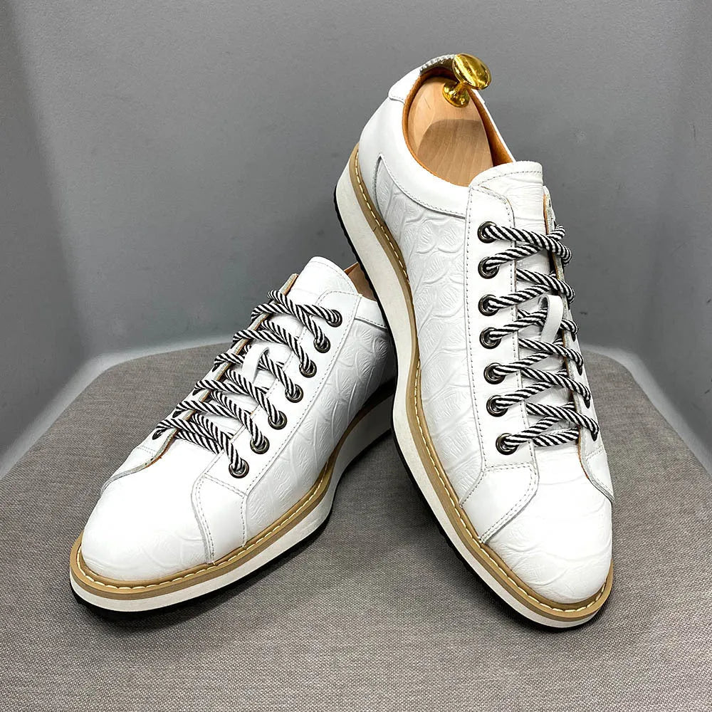 Men's low tube casual shoes with an embossed pattern on the upper and front tie laces.