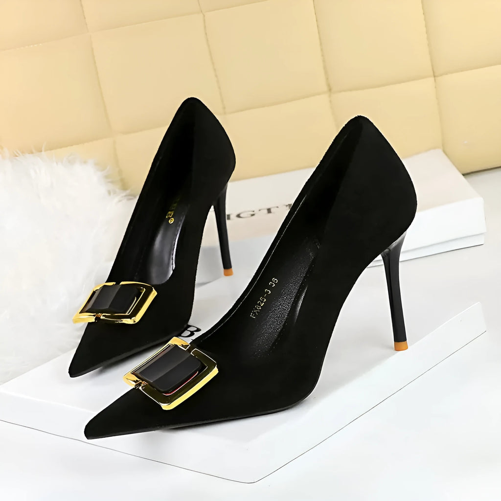 Black suede women's high-heel shoes with a 9cm stiletto heel and pointed toe on a plain background.