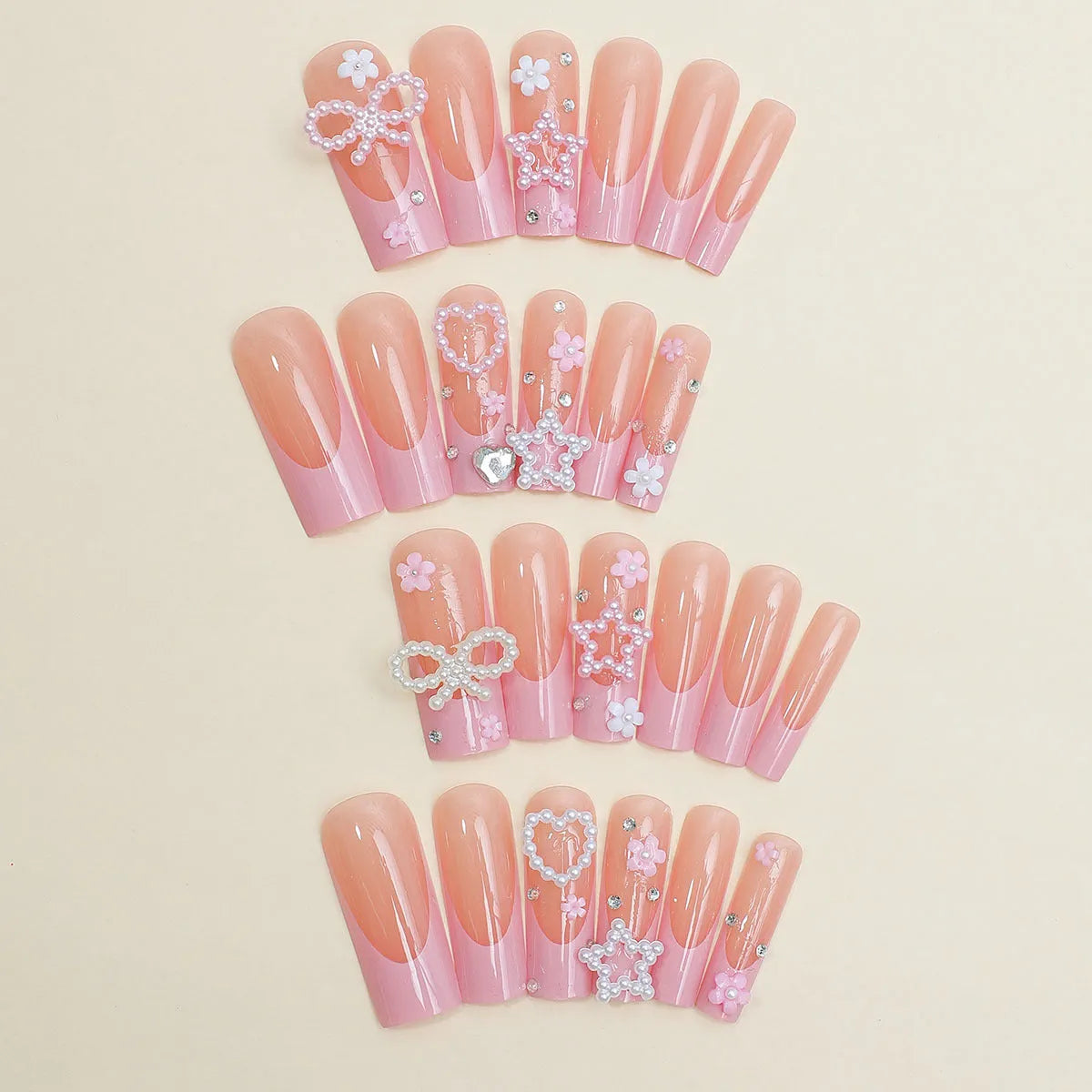 Super long French style artificial press-on nails with a decorative bow and spot drill accents in colour XB-70-48.
