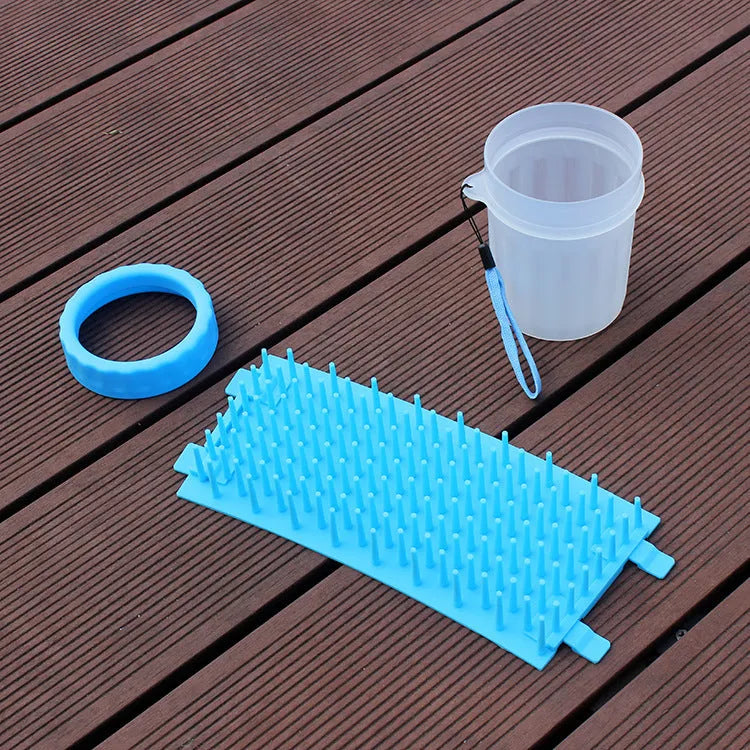 Blue silicone and plastic dog foot washing barrel with drainage hole for muddy paws