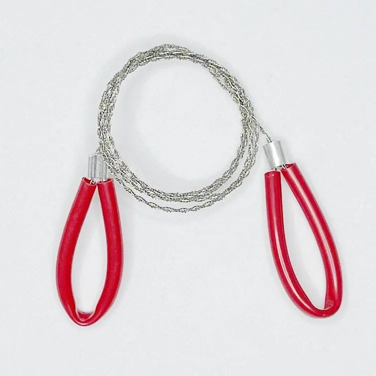 Black and red survival wire saw with leather case, showing coiled stainless steel wire and its compact size.