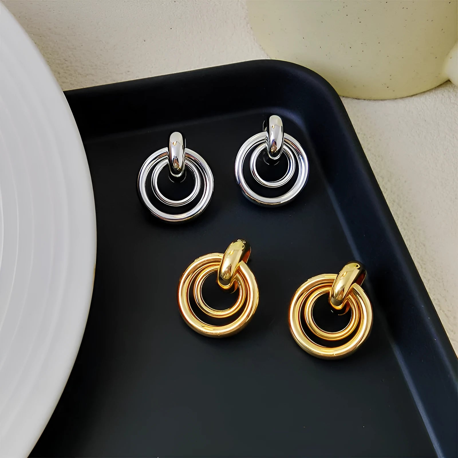 Geometric round ring earrings for women with electroplated gold or silver finishes and irregular contemporary design