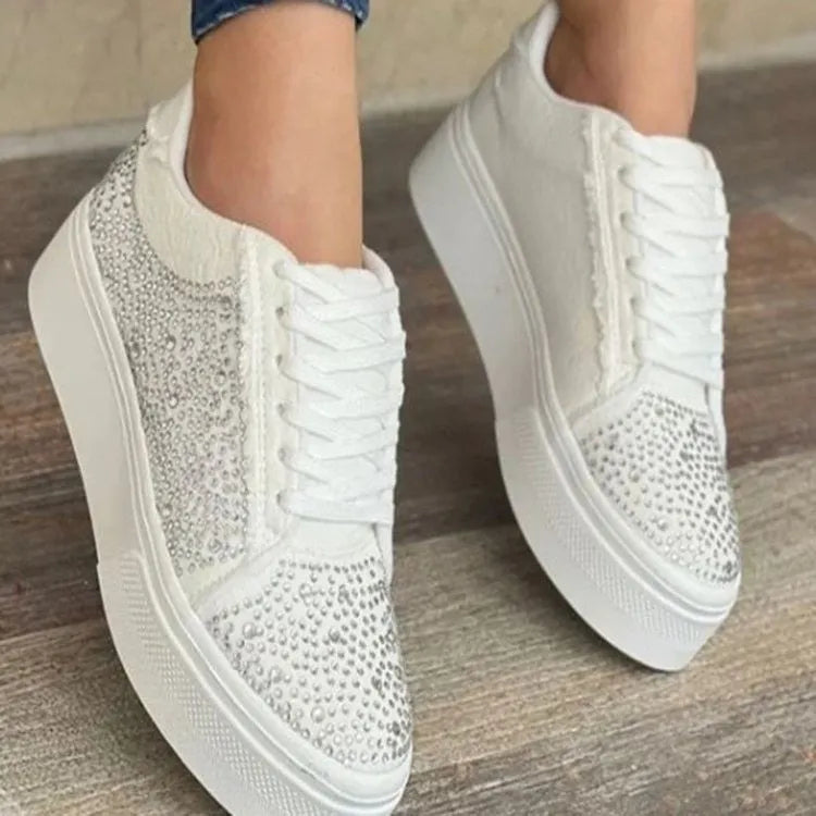 Women's black lace-up casual shoes with rhinestone detail and thick flat rubber sole.