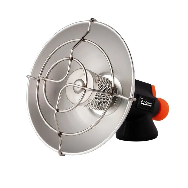 Black and orange portable outdoor camping heater stove with automatic ignition on a table.