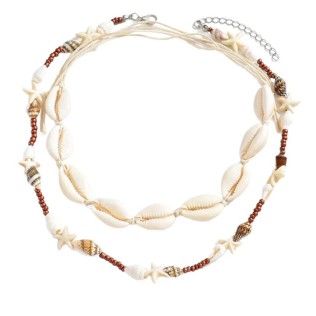 Handcrafted bohemian shell necklace with geometric pendant on a regular chain, colour X1900.