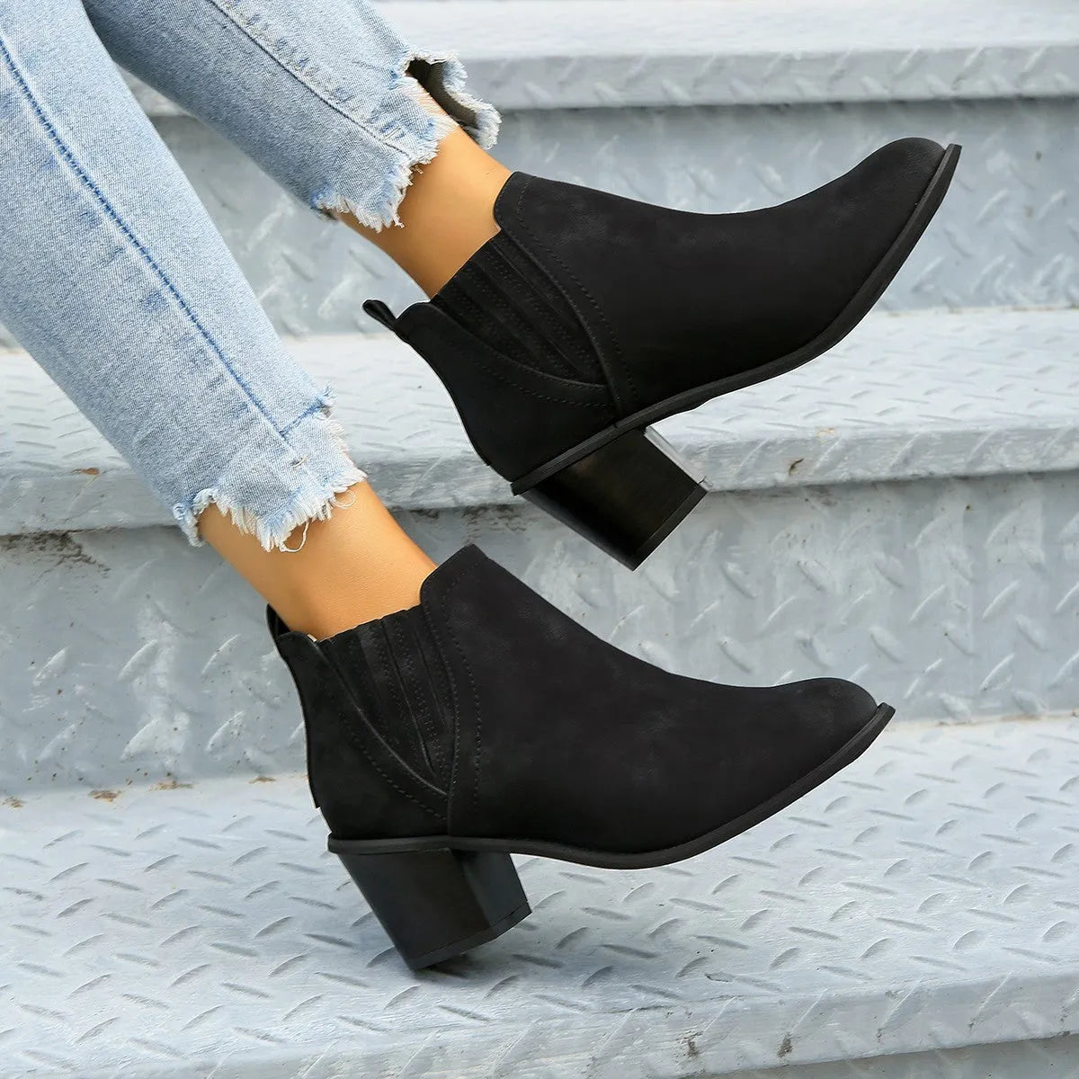 Women's black pointed toe ankle boots with a thick square low heel, made of artificial PU.