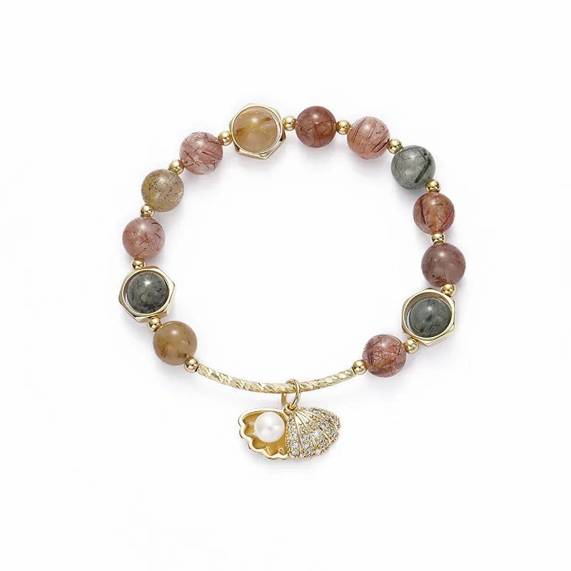 Colourful crystal shell bracelet with hair crystal detailing and red sealant flower shell accents