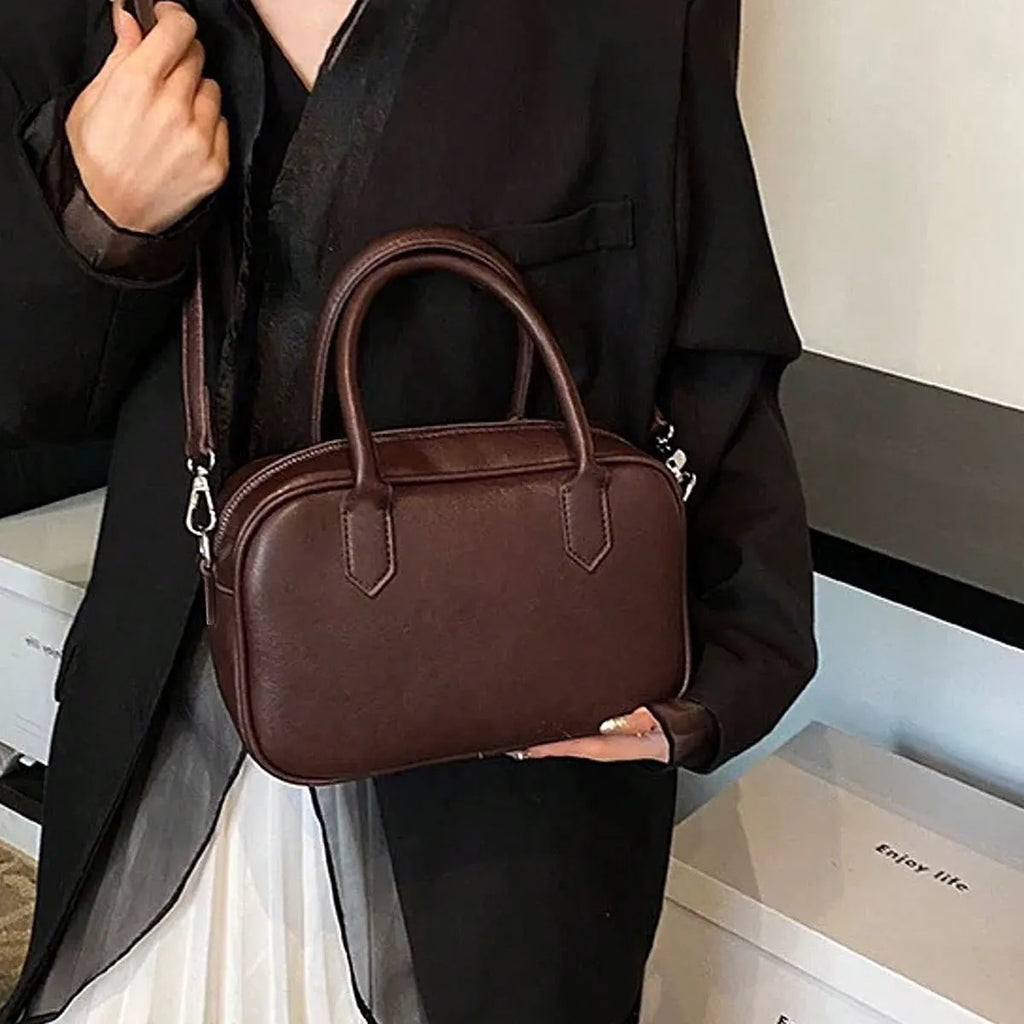 Retro horizontal square black PU leather messenger bag with a single shoulder strap