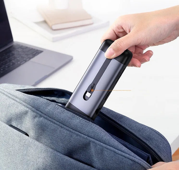 Compact USB dock expansion adapter with HDMI, USB 3.0, and charging ports on a short 0.09m cable.