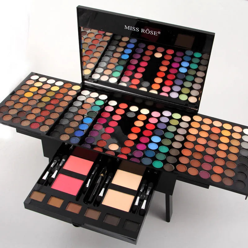 Piano-shaped makeup palette box containing 180 eyeshadow colours with powder, blush and contour cosmetics